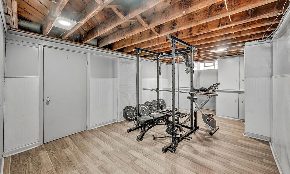 Finished basement set up as a home gym