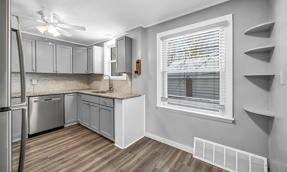 Updated kitchen with granite counters and stainless appliances