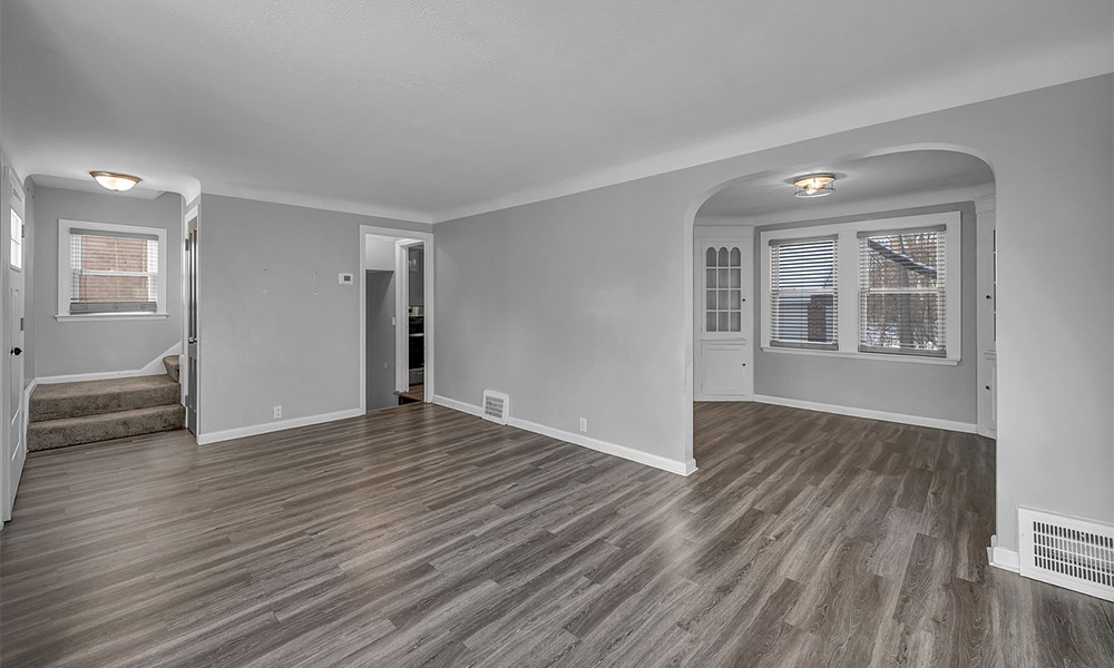 Open-plan living and dining room with refinished floors