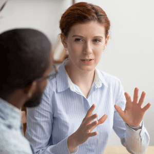 Woman explaining something to a man
